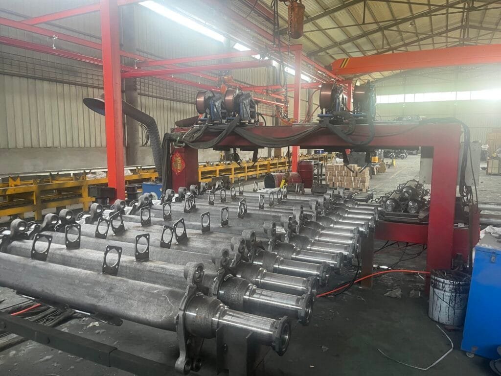 alt="JIUZHOU Factory Equipment – Four-Gun Automatic Welding Machine"