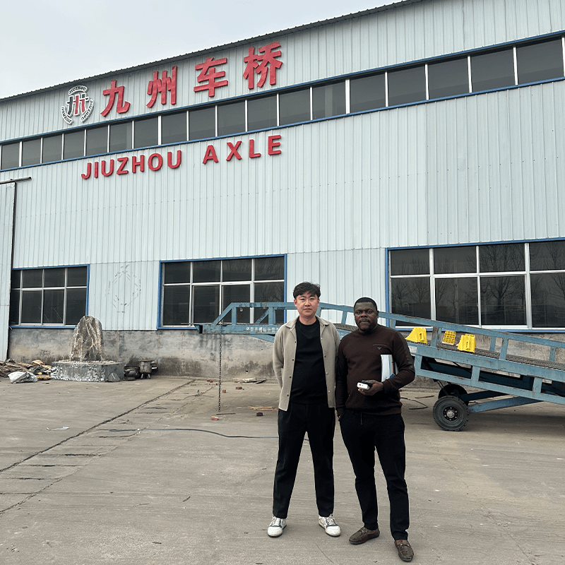 alt="Nigerian Buyer Touring JIUZHOU Workshop – Discussing Trailer Brake System Partnership"