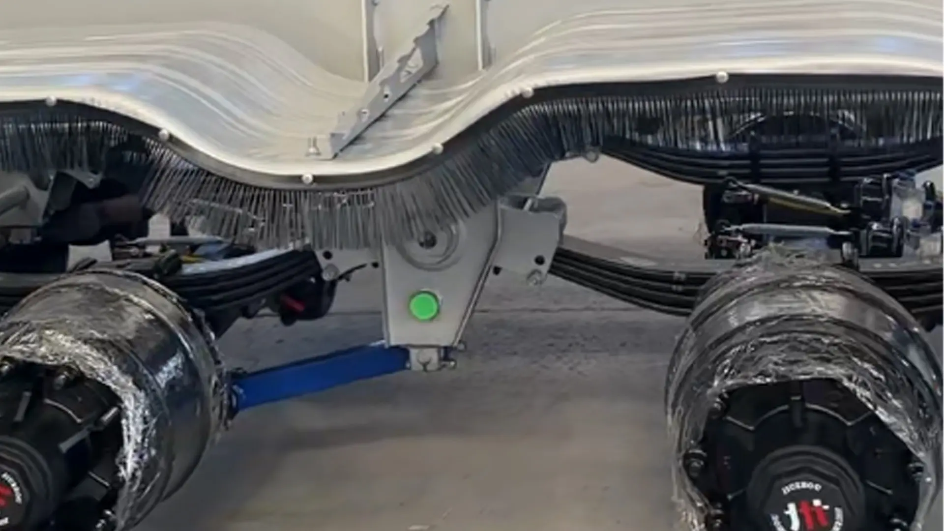 Heavy duty trailer mechanical suspension system detail axle and hanger assembly